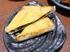 黑金奶香夹心面包-曼听小寨海鲜烧烤·大连辣炒大王(盖州街店)