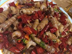 爆炒钉螺-街角等你.大连海鲜烧烤.经典铁板海鲜串(西安路店)