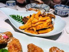 梭子蟹炒年糕-卯时·龙光雅宴·精致锡帮菜(惠山古镇店)