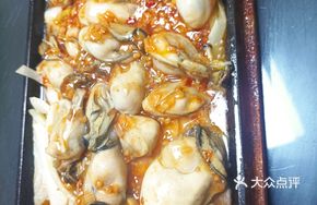 Garlic-Infused Grilled Oysters on Iron Plate
