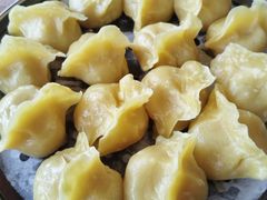 玉米面猪肉酸菜蒸饺-那家老院子东北菜·饺子·小鸡炖蘑菇(艳华街店)