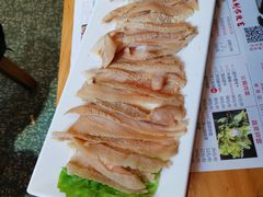 -明何记涮牛肚(品牌首店隋唐植物园南门古城路店)