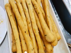 -明何记涮牛肚(品牌首店隋唐植物园南门古城路店)