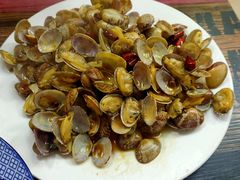 辣炒蛤蜊-1910老鲁味海鲜·戳子肉·青岛菜(金沙滩店)