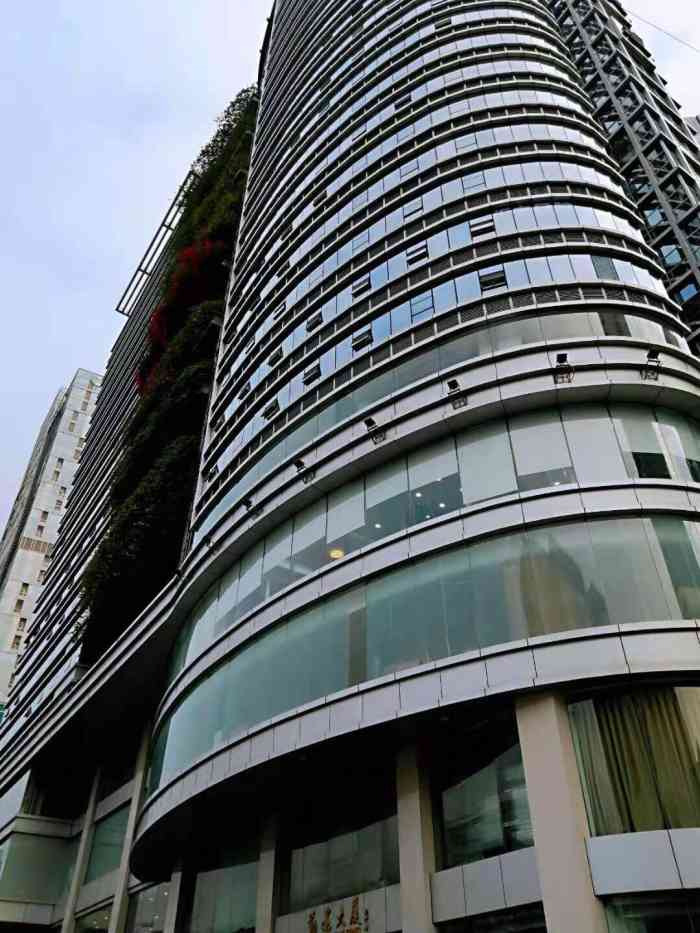 勤建商务大厦-"黄埔大道上的一栋不算很起眼的写字楼,多年.