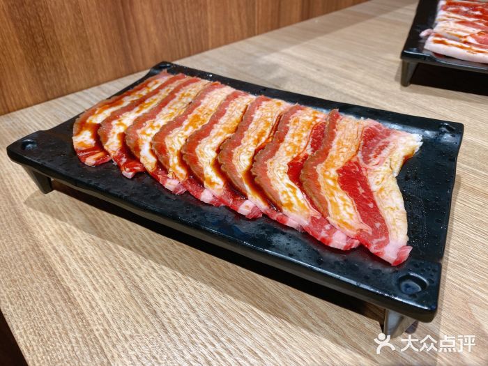 大浪炭火鲜牛肉酒场(绿地缤纷城店)秘制肥牛图片