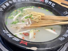 -明何记涮牛肚(品牌首店隋唐植物园南门古城路店)