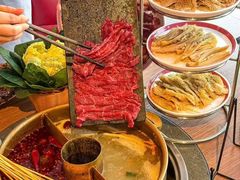 -明何记涮牛肚(品牌首店隋唐植物园南门古城路店)