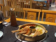 -明何记涮牛肚(品牌首店隋唐植物园南门古城路店)