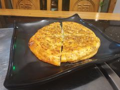 -明何记涮牛肚(品牌首店隋唐植物园南门古城路店)