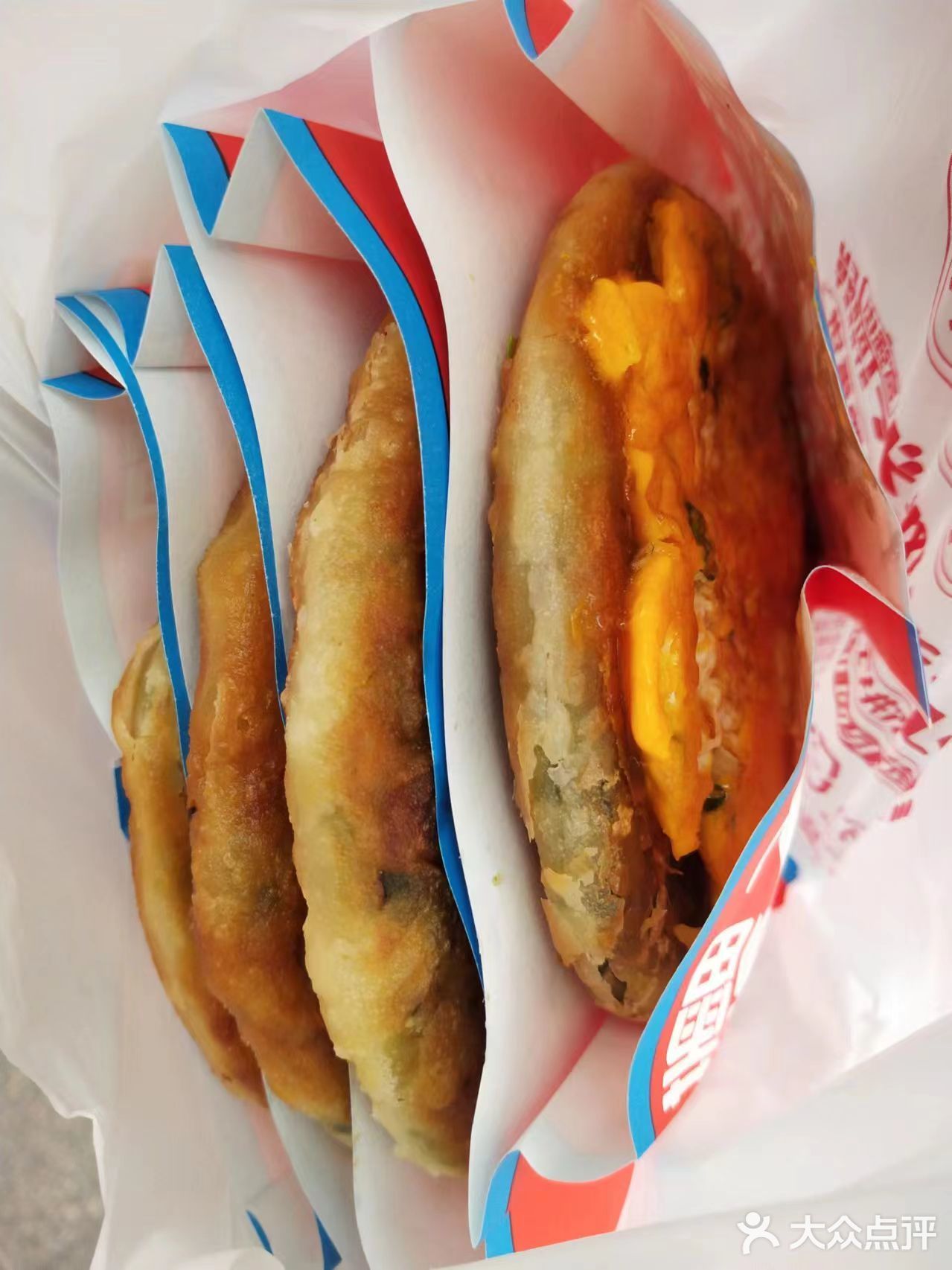 富强街的葱油饼啦啦也有啦