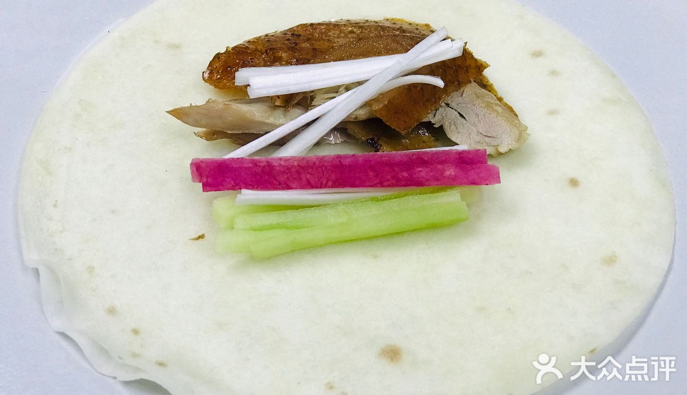 烤鸭配的薄饼每一张之间都隔了一张笼屉布