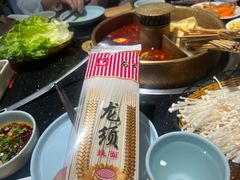 -明何记涮牛肚(品牌首店隋唐植物园南门古城路店)