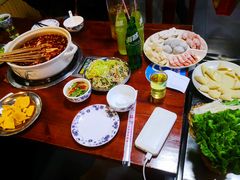-明何记涮牛肚(品牌首店隋唐植物园南门古城路店)
