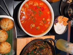 酸彩椒蛤蜊煮牛蛙-Ameigo梅果·云贵川bistro(长宁来福士店)