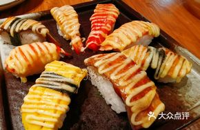 Flame Platter (One piece each of cooked shrimp, salmon skin, scallop, crab stick, tamago, glass shrimp, salmon, eel)