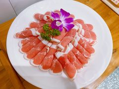 -明何记涮牛肚(品牌首店隋唐植物园南门古城路店)