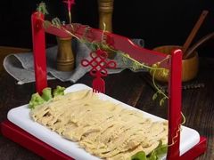 -明何记涮牛肚(品牌首店隋唐植物园南门古城路店)