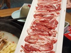 -明何记涮牛肚(品牌首店隋唐植物园南门古城路店)