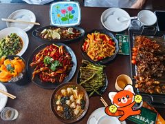 -曼听小寨海鲜烧烤·大连辣炒大王(盖州街店)