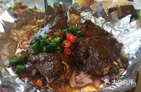 Sizzling Fish on Iron Plate