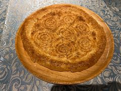 馕坑芝麻馕-巴扎美食·新疆菜·西域歌舞表演餐厅(新疆大厦店)