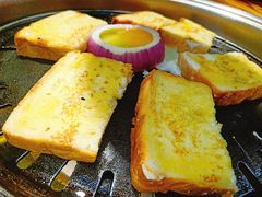 特色烤荷包鸡蛋-口岸齐齐哈尔烤肉(风尚米兰总店)