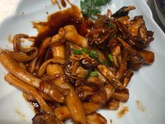 梭子蟹炒年糕-卯时·龙光雅宴·精致锡帮菜(惠山古镇店)