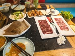 -明何记涮牛肚(品牌首店隋唐植物园南门古城路店)