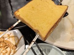 -明何记涮牛肚(品牌首店隋唐植物园南门古城路店)