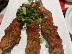 烤羊肉串-三人行骨头王火锅(长寿店)