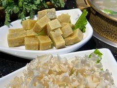 -明何记涮牛肚(品牌首店隋唐植物园南门古城路店)