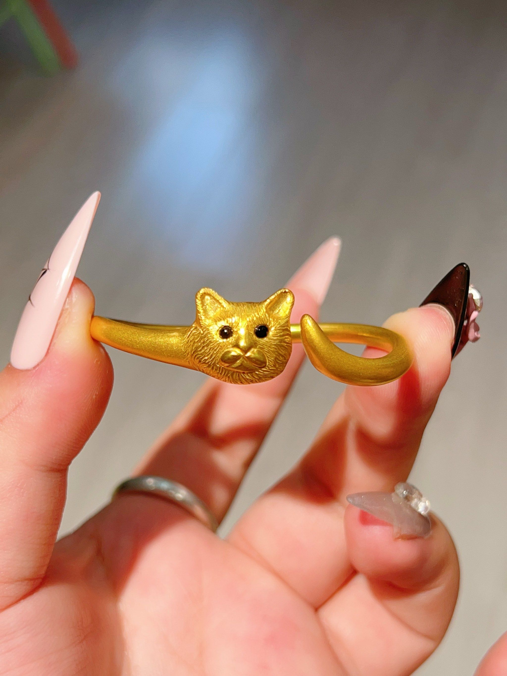 这个用黄金做的猫头也太可爱了吧