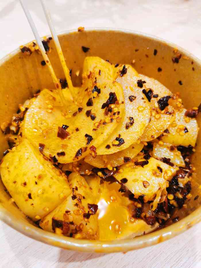 丁家坡洋芋(九龙好吃街店)-"杨家坪九龙好吃街一进去就能见到这家洋芋