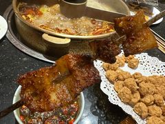 -明何记涮牛肚(品牌首店隋唐植物园南门古城路店)