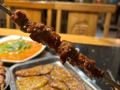 -明何记涮牛肚(品牌首店隋唐植物园南门古城路店)