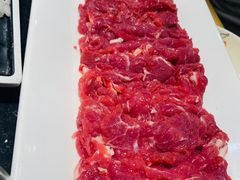 -明何记涮牛肚(品牌首店隋唐植物园南门古城路店)