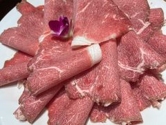-明何记涮牛肚(品牌首店隋唐植物园南门古城路店)