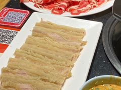 -明何记涮牛肚(品牌首店隋唐植物园南门古城路店)