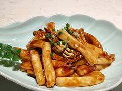 梭子蟹炒年糕-卯时·龙光雅宴·精致锡帮菜(惠山古镇店)