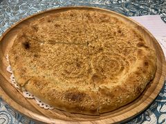 馕坑芝麻馕-巴扎美食·新疆菜·西域歌舞表演餐厅(新疆大厦店)