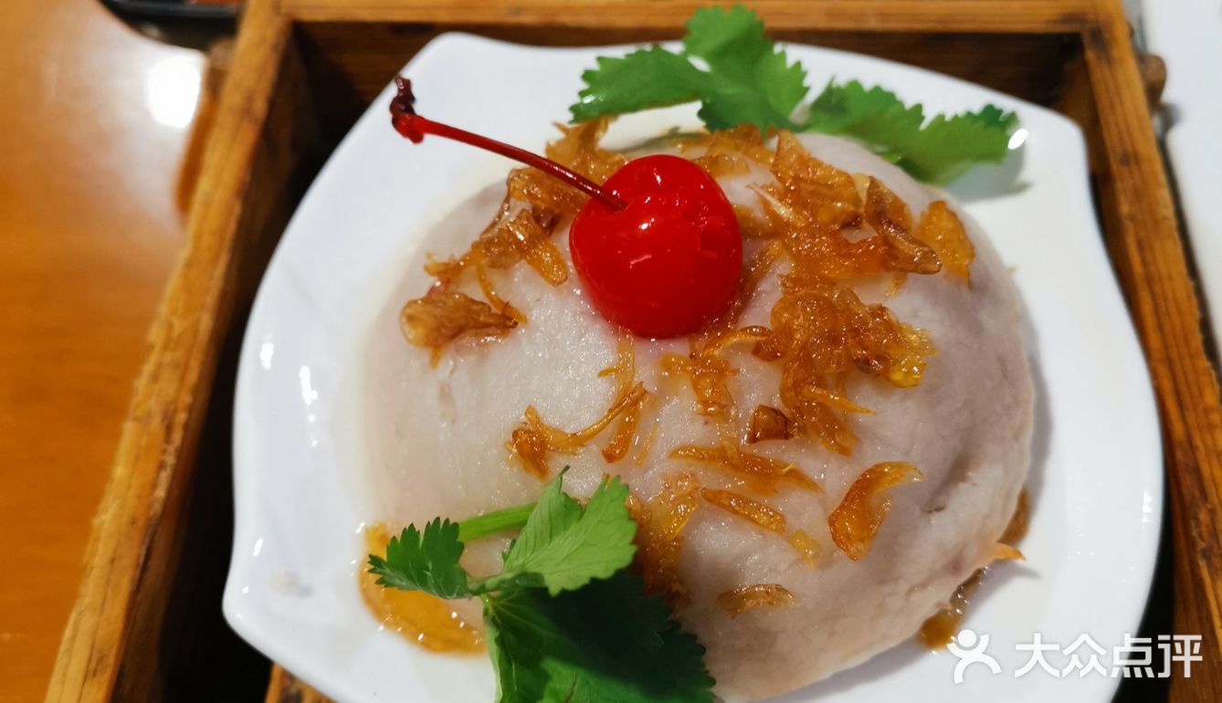 四代传承的芋包王餐厅很有闽南特色桌子上有个电罐