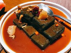 猴头菇鲍汁瑶柱扒制黑豆腐-肴约·花园式餐厅(湖里店)