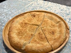 馕坑芝麻馕-巴扎美食·新疆菜·西域歌舞表演餐厅(新疆大厦店)