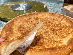 馕坑芝麻馕-巴扎美食·新疆菜·西域歌舞表演餐厅(新疆大厦店)