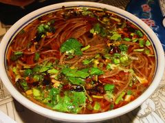 庙会摊上的冒饸饹-遇见长安(兰州中心店)