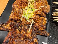 -明何记涮牛肚(品牌首店隋唐植物园南门古城路店)