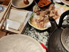 -老牌坊云南鱼豆花火锅(哈西万达店)