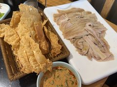 -明何记涮牛肚(品牌首店隋唐植物园南门古城路店)