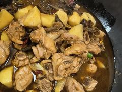 铁锅炖小鸡-冰城焰会大丰收铁锅炖(萝岗万达金街店)